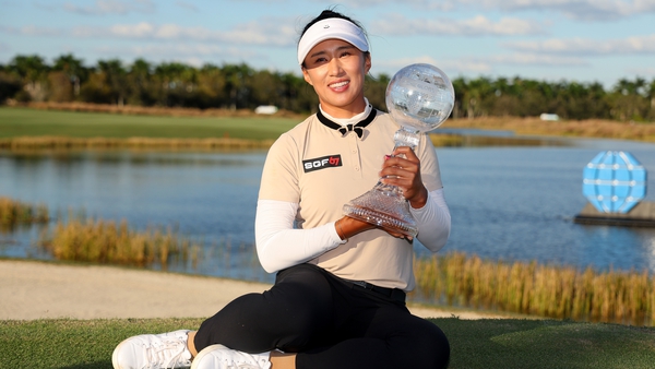 Amy Yang poses with the trophy