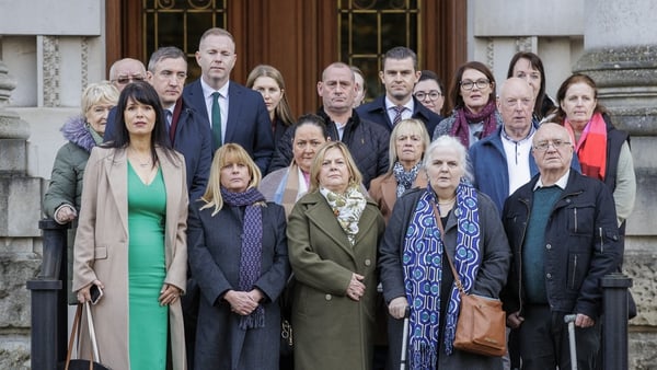 Relatives of some of those murdered during the Troubles appear outside court in Belfast