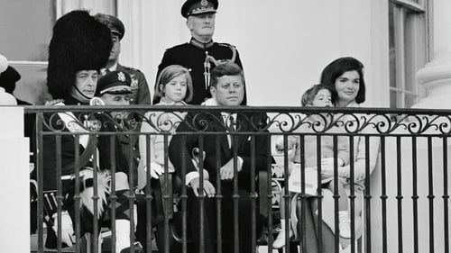 US president John F Kennedy and his family watch the Black Watch band perform at the White House a few days before his assassination. At left is Maj. W.M. Wingate Gray, commander of the Black Watch. Photo: Bettmann/Getty Images