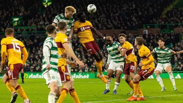 Jonathan Obika heads Motherwell to a draw after beating Liam Scales to the ball