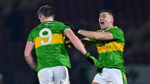 Emmett Bradley of Glen (L) celebrates his crucial score with Ciaran McFaul