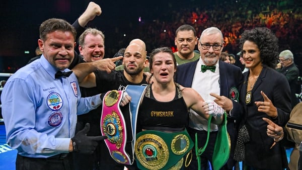 Katie Taylor celebrates a famous win with her team