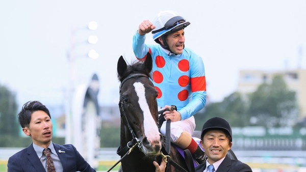 French-born jockey Christophe Lemaire celebrates after riding horse Equinox to victory