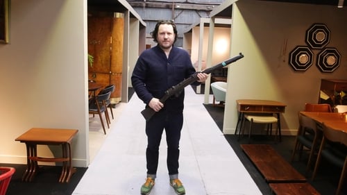 Niall Mullen with a prop rifle used in Michael Collins