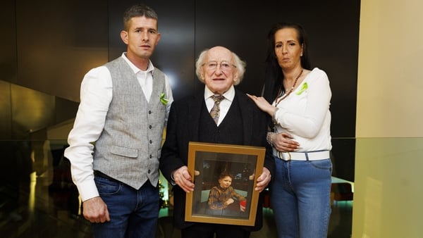 President of Ireland Michael D Higgins with Patrick's parents Pat and Michelle McDonagh at a screening of the RTÉ documentary Patrick: A Young Traveller Lost