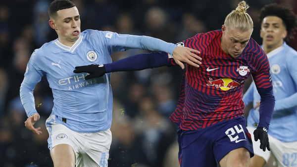 Phil Foden challenges Xaver Schlager of RB Leipzig