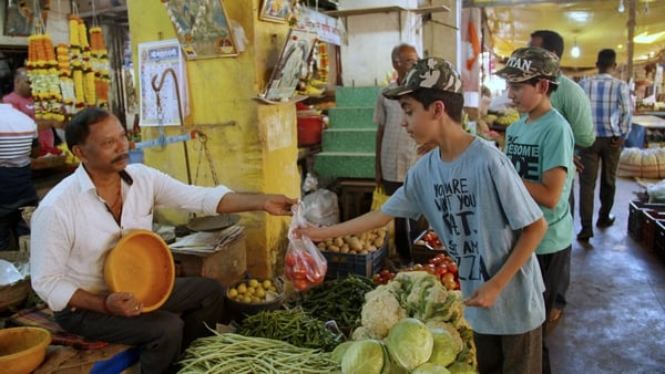 Ishaan and Vihaan at a market in India.