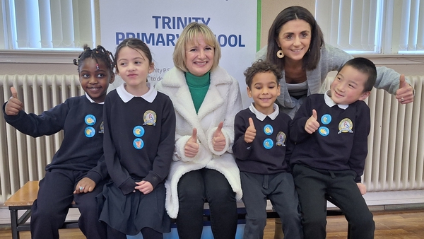 Professor Breda Smyth with pupils from Trinity Primary School