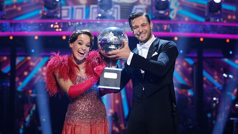 Ellie Leach and Vito Coppola lift the glitterball trophy