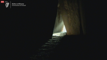 Newgrange passage partially illuminated during Winter Solstice