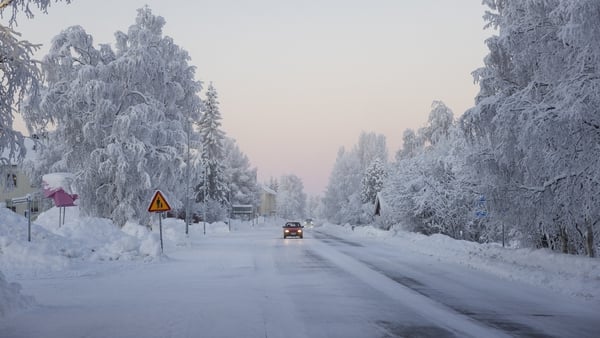 Snow and frost cover a road in Vittangi in northern Sweden