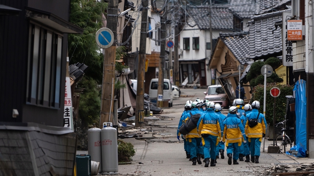 Police officers searching for survivors in Wajima today