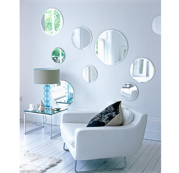 Collection of circular mirrors with glass lamp