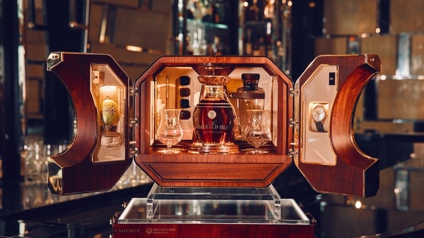 The Emerald Isle's case includes a single decanter, alongside a Fabergé egg - containing an emerald gem - a custom timepiece and a pair of Cohiba cigars