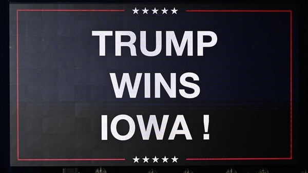 A sign declares Donald Trump's victory in Iowa
