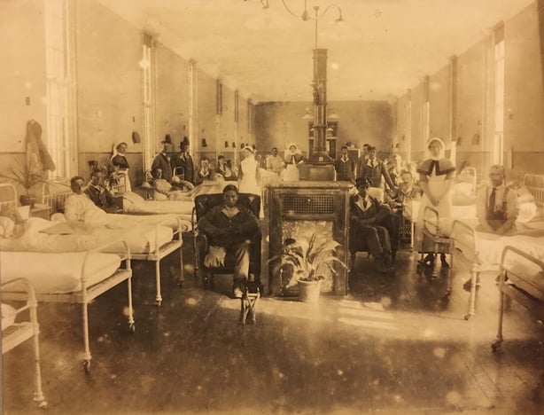 Sepia photo of a hospital ward in 1916