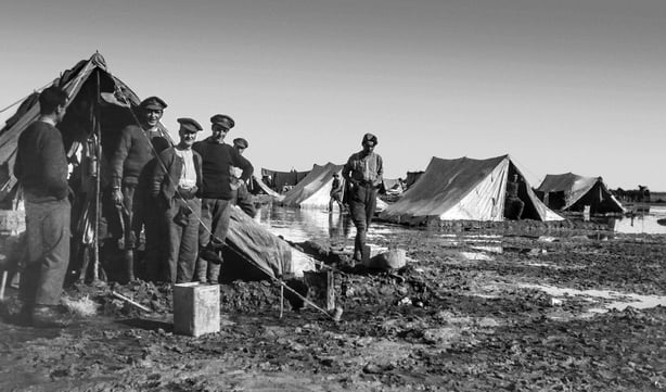 WW1 photographs in Iraq  Mesopotamia  and surrounding areas British Royal Engineers British troops in Baqubah camp during a flood Soldiers standing outside their tents. (Photo by: Universal History Archive/Universal Images Group via Getty Images)