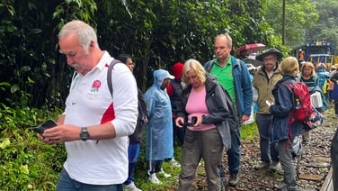 Tourists trek to Machu Picchu on foot as protests shut down train line