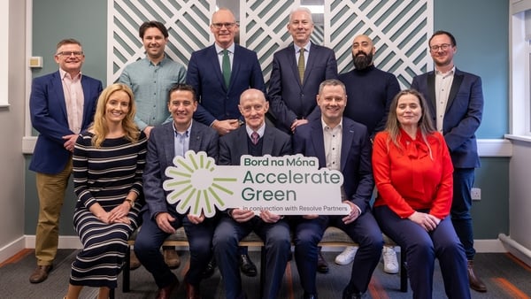 Minister for Enterprise, Trade and Employment Simon Coveney, Chairman of Bord na Móna Geoff Meagher, CEO of Bord na Móna Tom Donnellan and the eight business participants of Bord na Móna 2024 Accelerate Green Programme