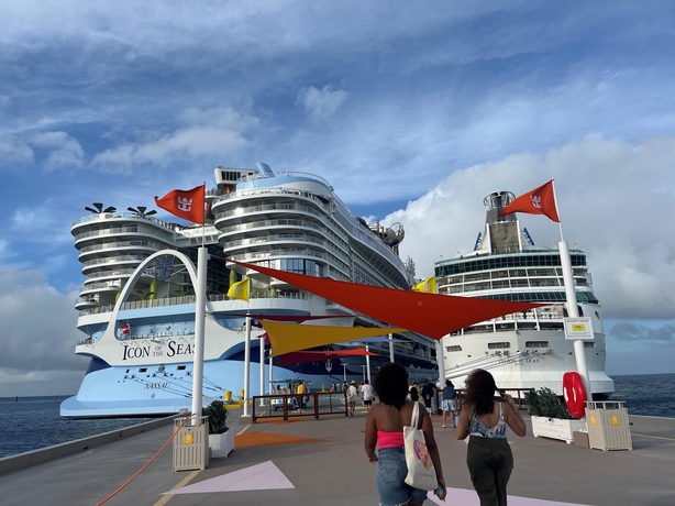 Icon of the Seas towers above another cruise ship while docked at CocoCay (PA)