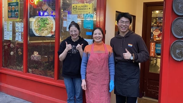 Yuqing Guo (centre) seen with staff outside her restaurant on Parnell Street