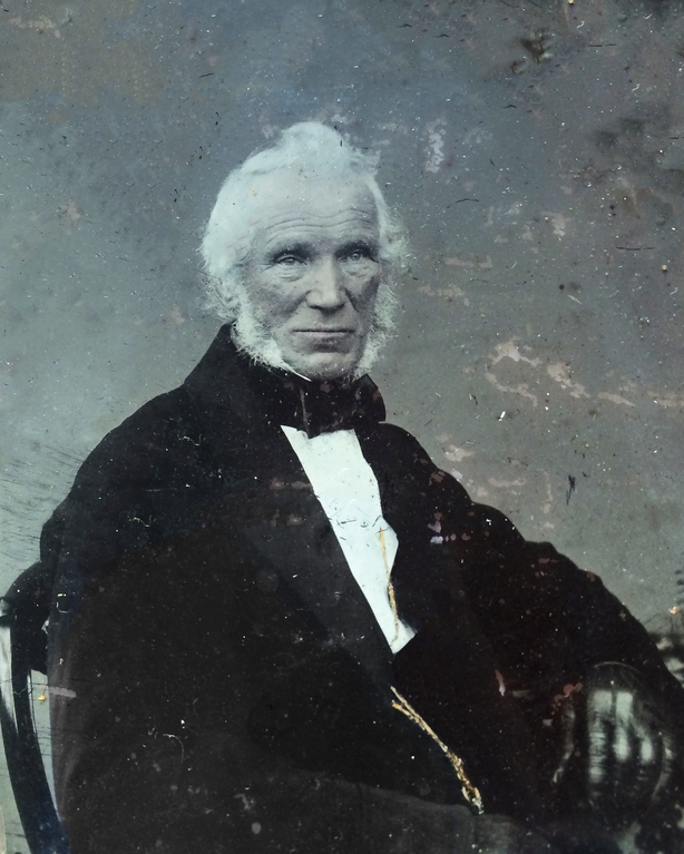 Black and white Victorian photo of a white haired man