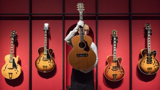 Dire Straits icon Mark Knopfler's guitars sell for more than £8million at  auction