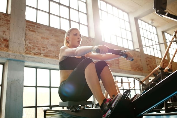 Woman on a rowing machine