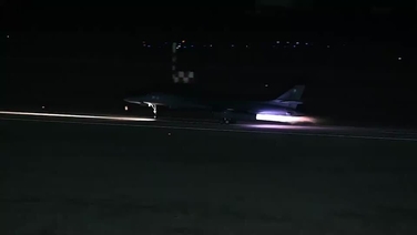 US release footage showing a B-1 bomber taking off from a runway after strikes were launched in Iraq and Syria