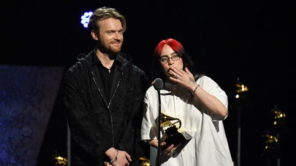 Billie Eilish and Finneas O'Connell accept the award for Song Written For Visual Media at the 66th Grammy Awards Premiere Ceremony held at the Peacock Theater in Los Angeles on Sunday. (Robert Gauthier/ Los Angeles Times)