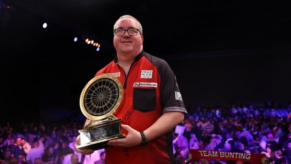 Stephen Bunting shows off his prize after winning the Cazoo Masters