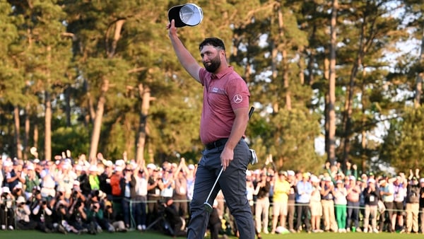 Jon Rahm celebrates on the 18th green after winning the Masters