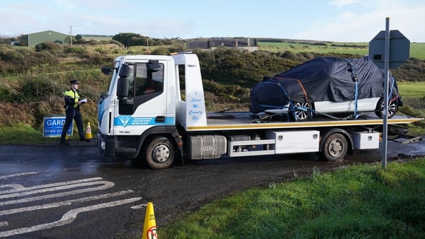 A car is removed from Rathmoylan, Dunmore East, Co Waterford, where police are investigating the death of a six-year-old boy whose body was found in a car