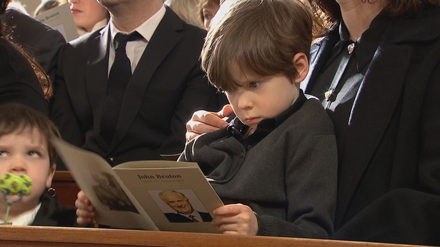 One of John Bruton's grandchildren seen during his grandfather's funeral mass