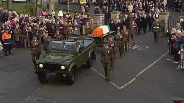 John Bruton's funeral cortège departs church