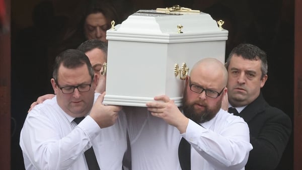 James Healy (R) carries his son's coffin from Church of the Immaculate Conception following the funeral mass
