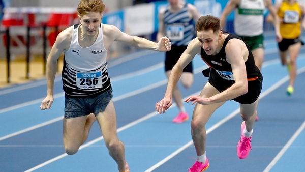 Nick Griggs of CNDR AC, Antrim (L) and Cathal Doyle of Clonliffe Harriers AC, Dublin, fall at the finish line in the 1500m