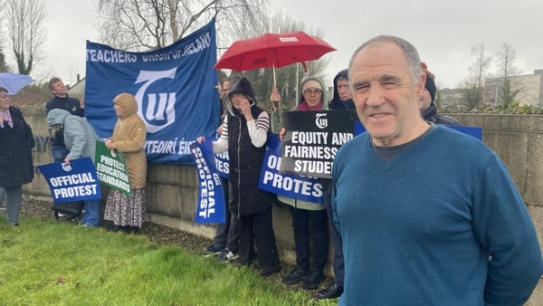 Chair of the Dundalk branch of the Teachers Union of Ireland Kevin Howard with protesters