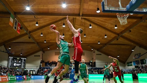 Ireland's Rapolas Buivydas tries to avoid the block from Killian Martin of Switzerland