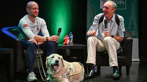 Irish para-triathlete Donnacha McCarthy (L) with his former coach Dave Tilley and guide dog Aero at Paralympics Ireland's ''6 Months to Go' ' event