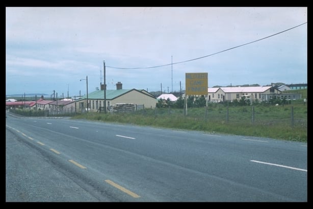 Colour photo of buildings on a country road