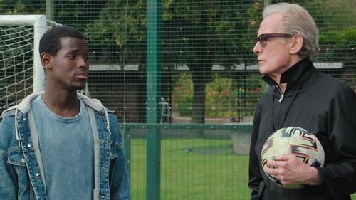 Bill Nighy with co-star Michael Ward in a scene from The Beautiful Game