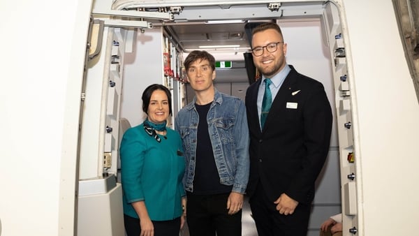 Aer Lingus Cabin Crew Sarah Browne and Rhys Donohue welcoming Cillian Murphy as he boards Aer Lingus flight EI 069 to Los Angeles, ahead of the Academy Awards taking place Sunday Photo credits: Naoise Culhane