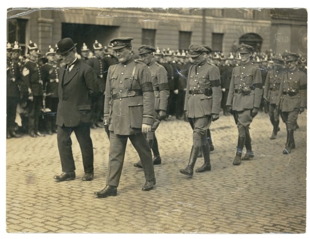 A funeral procession in military uniform