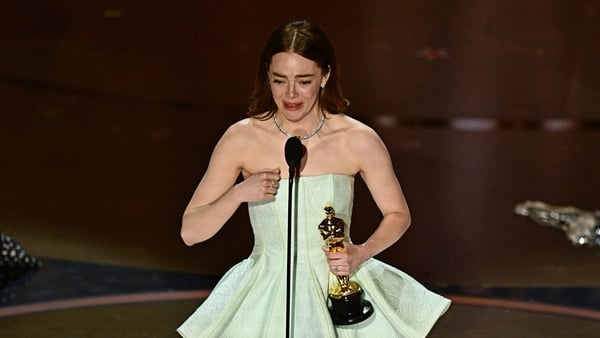 An emotional Emma Stone accepting her Best Actress Oscar on Sunday night