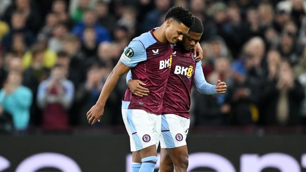 Aston Villa's Ollie Watkins (L) is consoled by teammate Leon Bailey