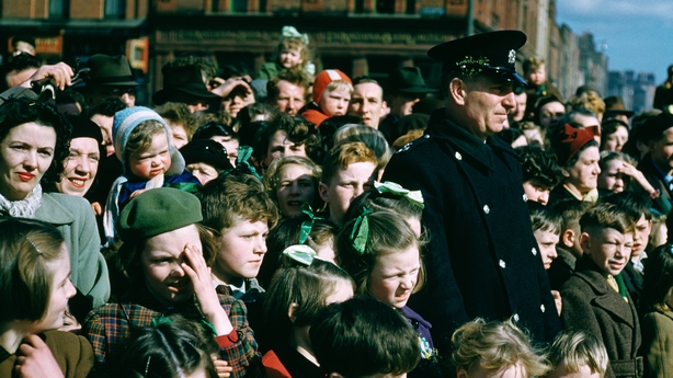 A crowd watching a St Patrick's Day street parade in Dublin, Eire, June 1955