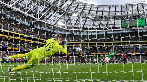 Belgium goalkeeper Matz Sels saves Evan Ferguson's spot-kick