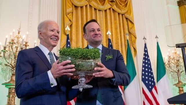 US President Joe Biden is given a bowl of shamrock for the St Patrick's day reception in Washington 2024