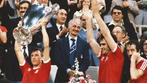 Larry Lloyd (centre) applauds as Nottingham Forest captain John McGovern lifts the European Cup in 1979